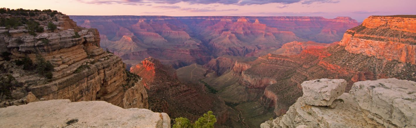 Grand Canyon Sunset The Grand Canyon National Park with pink light from the sunset scattered across the stone walls.