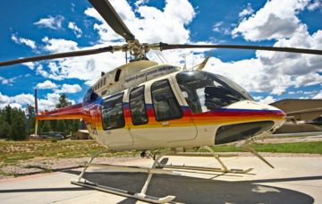 Papillon Grand Canyon Helicopters Tour North Canyon EcoStar A Papillon Grand Canyon Helicopter EC130 aircraft flying over the South Rim of the canyon