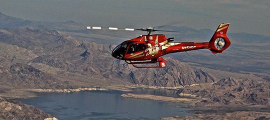Red EC-130 flying over Lake Mead