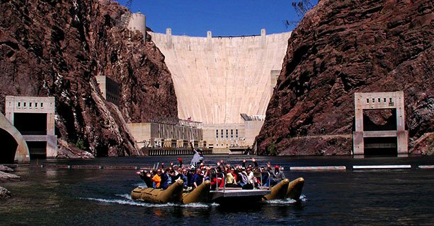Guests on a Raft on the Colorado River in front of the Hoover Dam