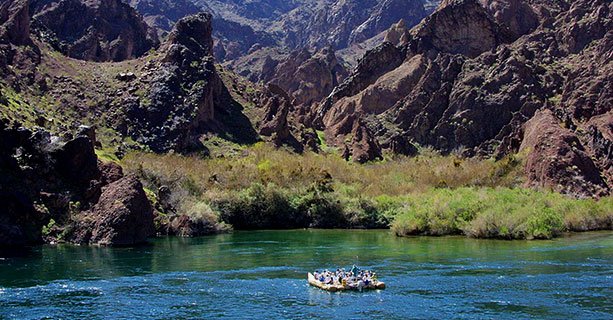 Guests Exploring the Colorado River in a raft'