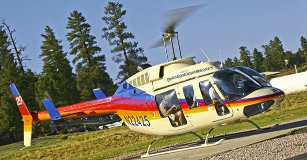 Bell helicopter taking off from the Grand Canyon National Park Heliport